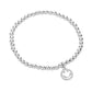 Silver Stainless Steel Stone Paved Smile Emoji Charm Stretch Ball Bracelet is a unique and stylish accessory that adds a touch of fun and playfulness to any outfit. Made with high-quality stainless steel and adorned with a stone paved smile emoji charm, this stretch bracelet is not only durable but also eye-catching. Complete your look with a smile, and get ready to receive compliments.