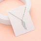 Silver Stainless Steel Stone Paved Wing Pendant Necklace is a unique and stylish piece of jewelry that is perfect for any occasion. Made with high-quality stainless steel, it is durable and resistant to tarnishing. The intricate pave design adds a touch of elegance, making it a perfect addition to any outfit. Elevate your style with this eye-catching necklace.
