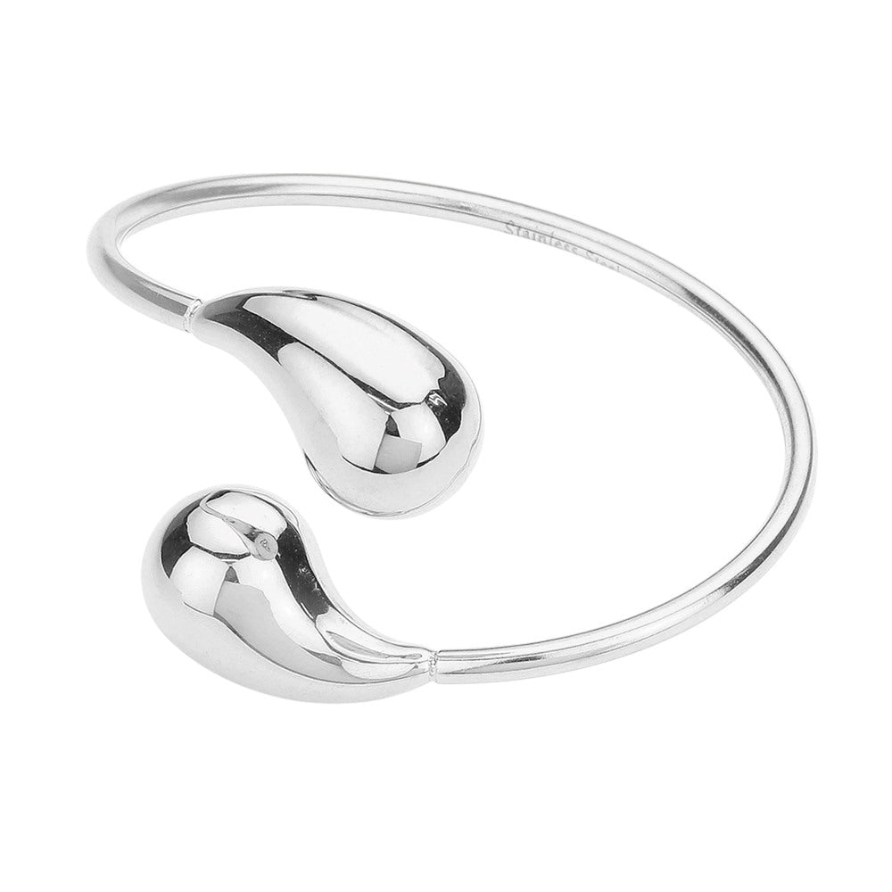 Silver Stainless steel teardrop tip wire bangle bracelet offers a sleek and modern design, perfect for any outfit. Made with durable materials, it is both stylish and long-lasting. Add a touch of elegance to your wardrobe with this stunning bracelet.