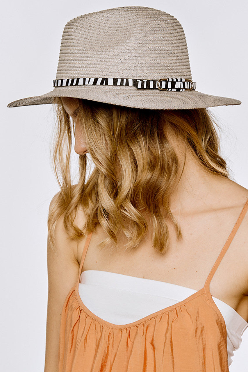 Silver Zebra Pattern trim Panama Summer Hat features an authentic zebra pattern trim, showcasing superior artisanal craftsmanship. The precisely woven natural fibres create optimal ventilation while maintaining structural integrity throughout extended wear. The scientifically calibrated brim width provides maximum UV protection without compromising peripheral vision. A technical masterpiece that balances traditional hatmaking heritage with contemporary design sensibilities for the discerning summer enthusia