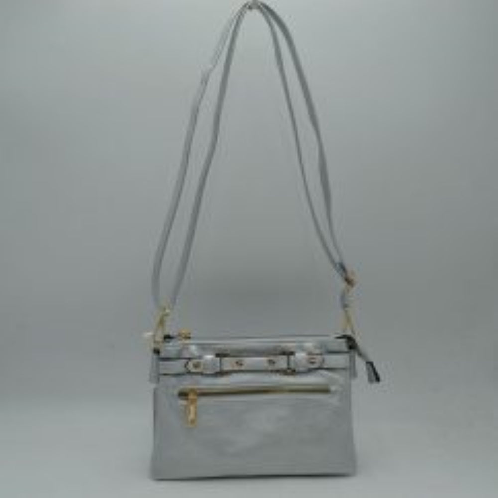 Silver This functional crossbody bag is designed for organized everyday use, featuring a textured exterior equipped with multiple secure storage compartments. The front panel includes a convenient horizontal zippered pocket accented with an oversized metallic zipper pull, situated beneath a decorative horizontal band detailed with metallic studs and loops.