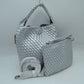 Silver This stylish everyday hobo bag features an all-over classic basket weave design and a slouchy silhouette. It is crafted with a seamless, integrated wide top handle that transitions directly into the main storage compartment for comfortable hand or shoulder carrying.