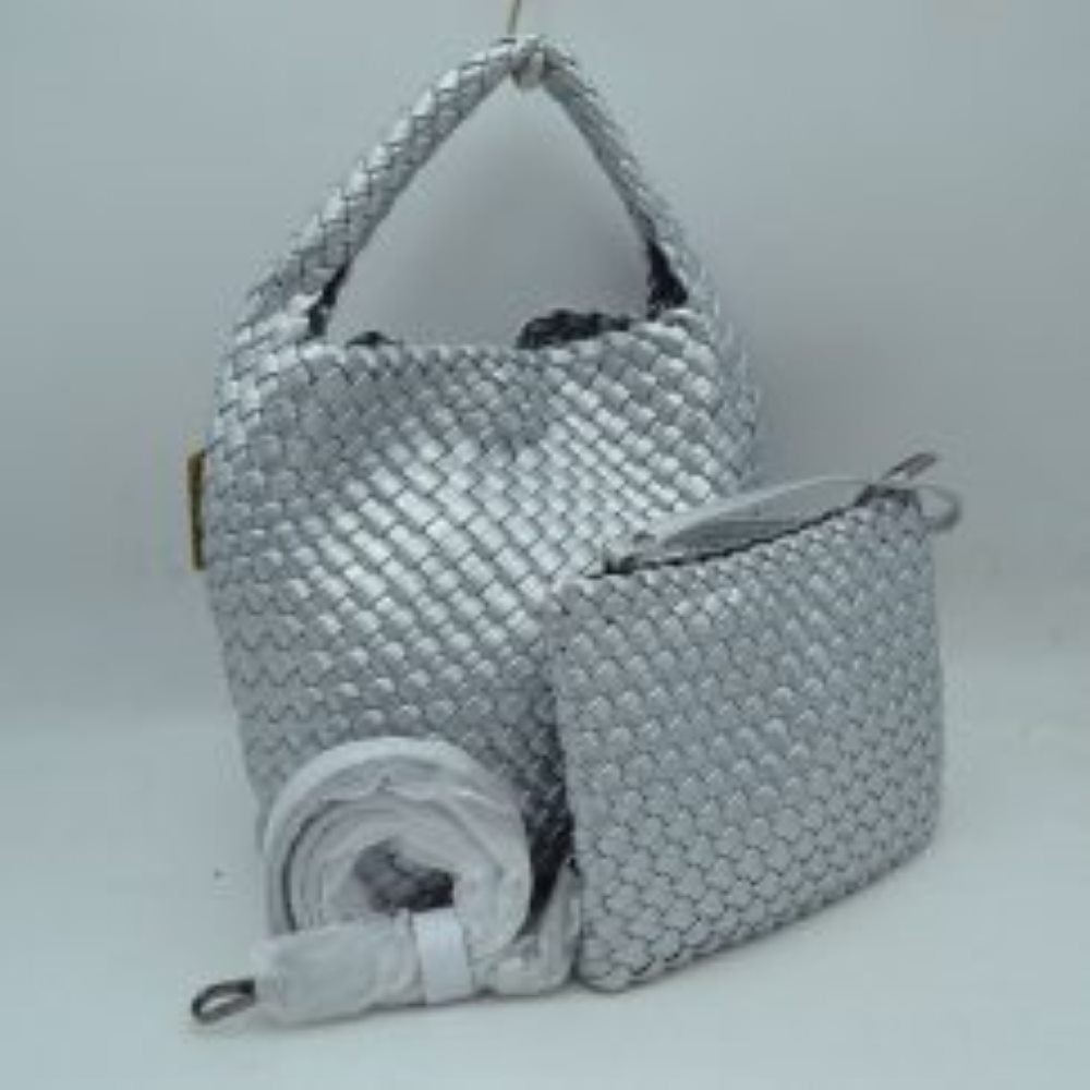 Silver This stylish everyday hobo bag features an all-over classic basket weave design and a slouchy silhouette. It is crafted with a seamless, integrated wide top handle that transitions directly into the main storage compartment for comfortable hand or shoulder carrying.