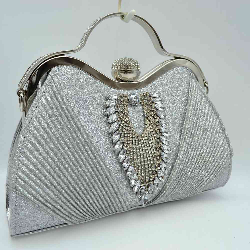 Silver Elevate your evening wear with this stunning, sophisticated evening clutch bag. Designed for special occasions, galas, weddings, and formal events, this purse seamlessly blends classic glamour with modern functionality.
