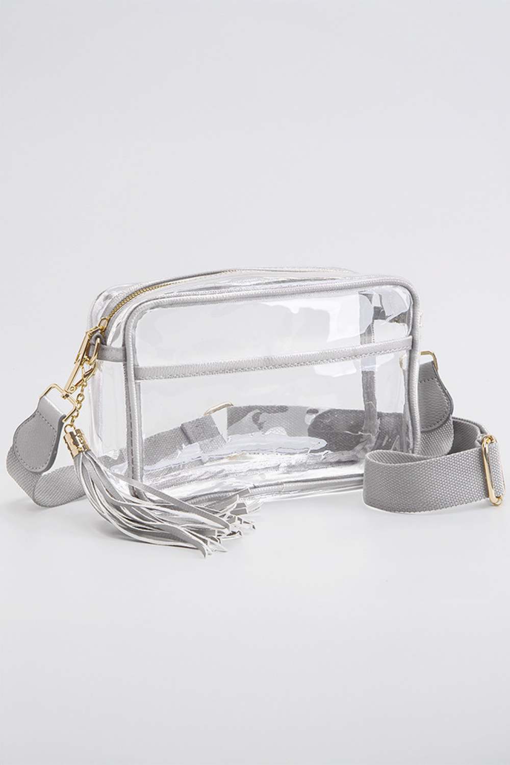 Silver Clear PU Cross Body Camera Bag offers a sleek, transparent design crafted from durable polyurethane, providing both style and protection for your camera gear. Its crossbody strap ensures comfortable, hands-free carrying, while the clear material allows quick visibility of contents for easy access. Ideal for photographers seeking a practical yet modern solution to transport and safeguard their equipment.