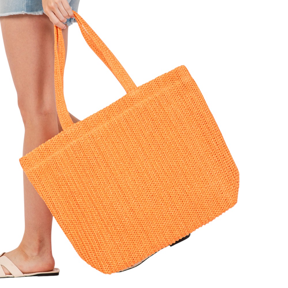 Orange Solid Crochet Straw Tote Bag is perfect for a day at the beach. Made from durable straw material, it features a spacious interior and sturdy handles for carrying all your essentials. Stay stylish and organized with this must-have accessory.