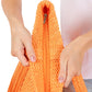 Orange Solid Crochet Straw Tote Bag is perfect for a day at the beach. Made from durable straw material, it features a spacious interior and sturdy handles for carrying all your essentials. Stay stylish and organized with this must-have accessory.