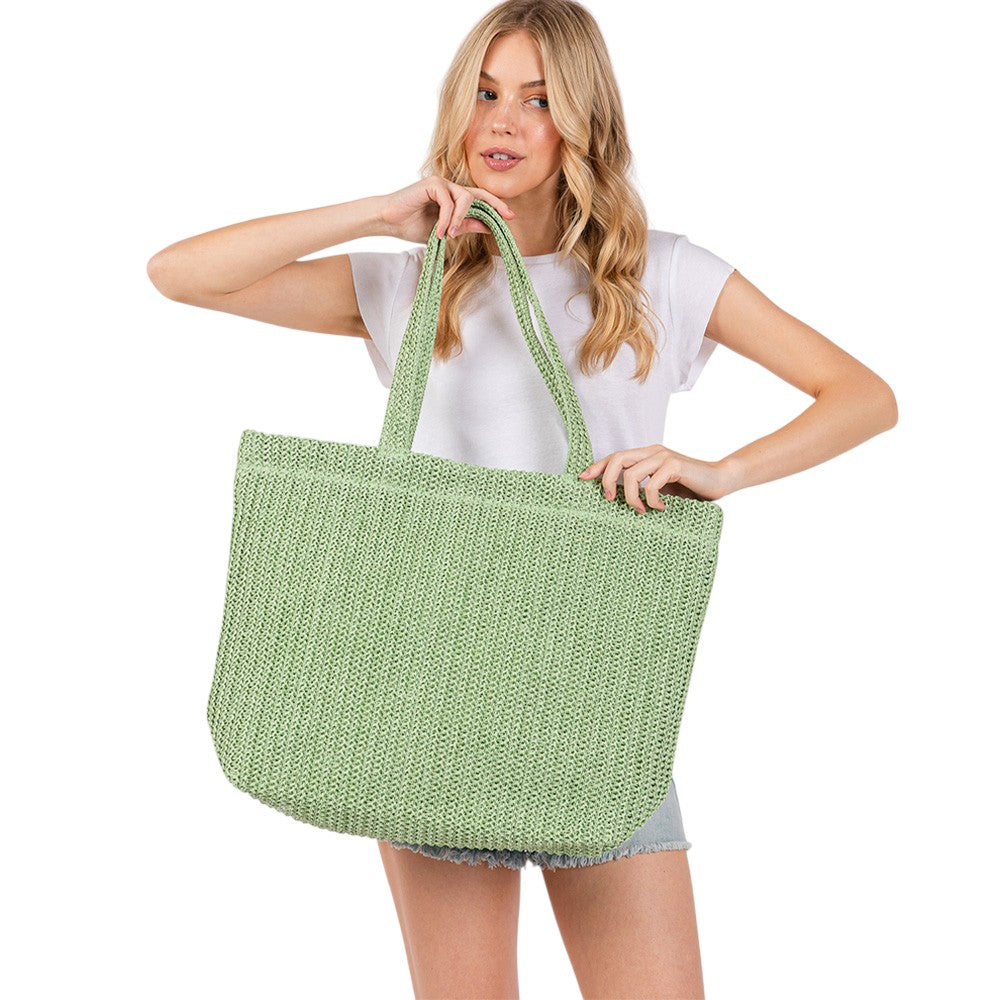 Olive Green Solid Crochet Straw Tote Bag is perfect for a day at the beach. Made from durable straw material, it features a spacious interior and sturdy handles for carrying all your essentials. Stay stylish and organized with this must-have accessory.