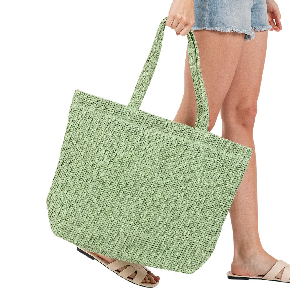 Olive Green Solid Crochet Straw Tote Bag is perfect for a day at the beach. Made from durable straw material, it features a spacious interior and sturdy handles for carrying all your essentials. Stay stylish and organized with this must-have accessory.
