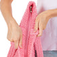Pink Solid Crochet Straw Tote Bag is perfect for a day at the beach. Made from durable straw material, it features a spacious interior and sturdy handles for carrying all your essentials. Stay stylish and organized with this must-have accessory.