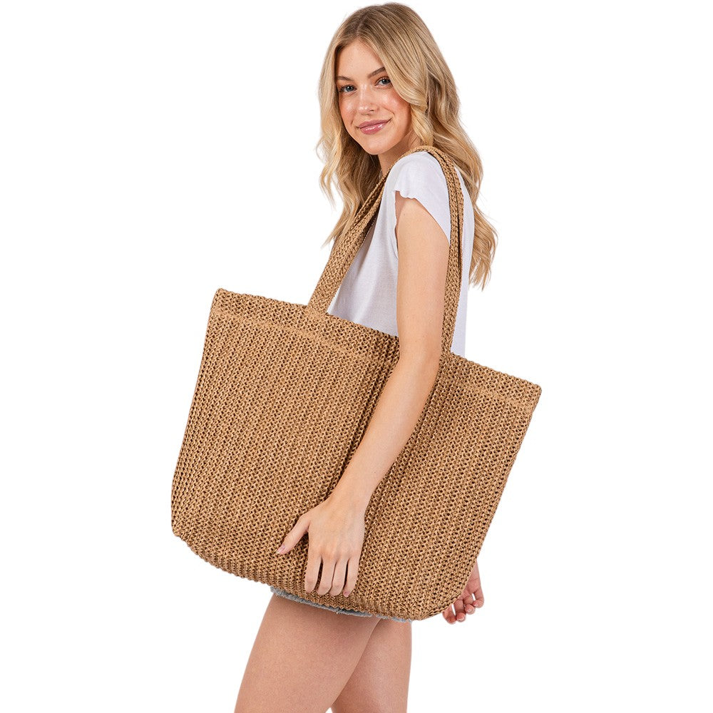 Taupe Solid Crochet Straw Tote Bag is perfect for a day at the beach. Made from durable straw material, it features a spacious interior and sturdy handles for carrying all your essentials. Stay stylish and organized with this must-have accessory.