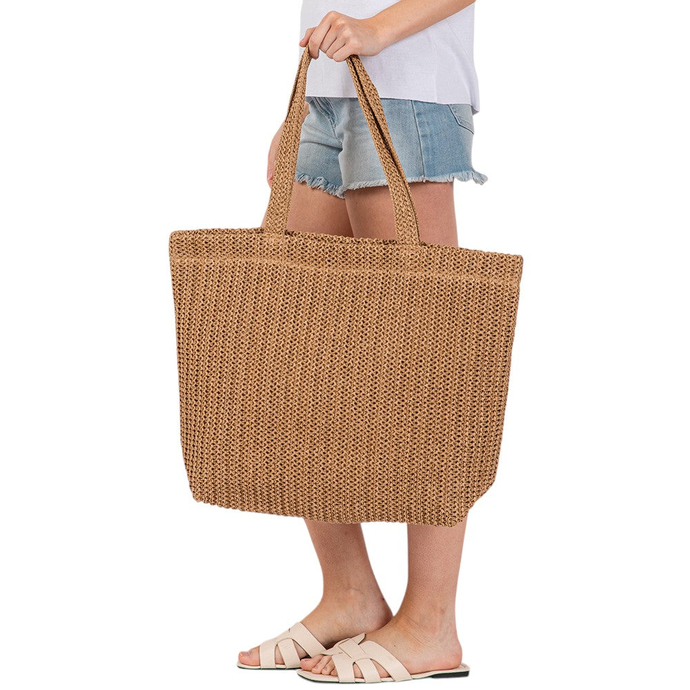 Taupe Solid Crochet Straw Tote Bag is perfect for a day at the beach. Made from durable straw material, it features a spacious interior and sturdy handles for carrying all your essentials. Stay stylish and organized with this must-have accessory.