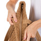 Taupe Solid Crochet Straw Tote Bag is perfect for a day at the beach. Made from durable straw material, it features a spacious interior and sturdy handles for carrying all your essentials. Stay stylish and organized with this must-have accessory.