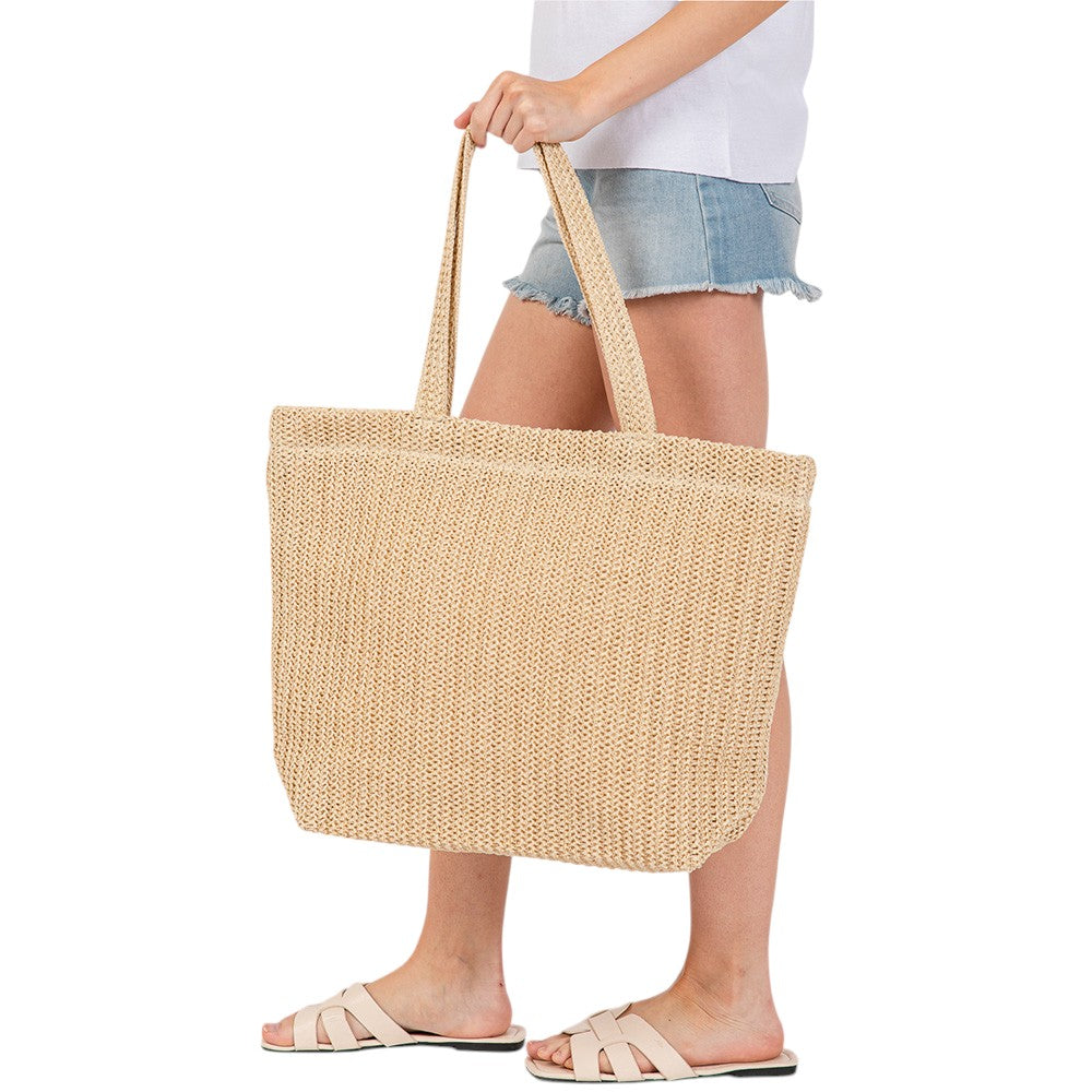 Beige Solid Crochet Straw Tote Bag is perfect for a day at the beach. Made from durable straw material, it features a spacious interior and sturdy handles for carrying all your essentials. Stay stylish and organized with this must-have accessory.