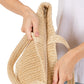 Beige Solid Crochet Straw Tote Bag is perfect for a day at the beach. Made from durable straw material, it features a spacious interior and sturdy handles for carrying all your essentials. Stay stylish and organized with this must-have accessory.