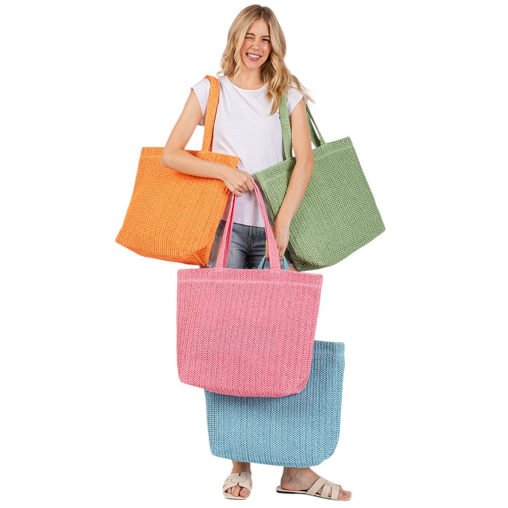 Beige Solid Crochet Straw Tote Bag is perfect for a day at the beach. Made from durable straw material, it features a spacious interior and sturdy handles for carrying all your essentials. Stay stylish and organized with this must-have accessory.