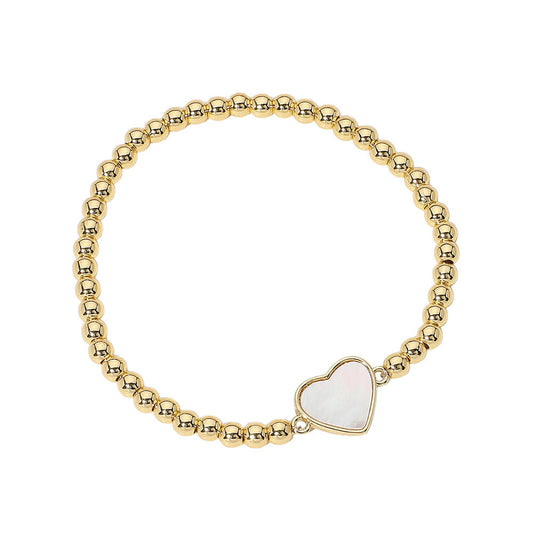Gold Stainless Steel Ball Mother of Pearl Heart Beaded Bracelet is expertly crafted with durable stainless steel and accented with a shimmering mother-of-pearl heart. The stretch design ensures a comfortable fit, making it perfect for everyday wear. Add a touch of elegance to any outfit with this sophisticated accessory. 