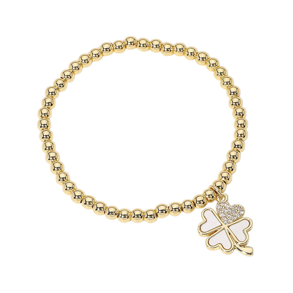 Gold Stainless Steel Ball Stone Paved Mother of Pearl Clover Charm Beaded Stretch Bracelet is adorned with a delicate Mother of Pearl Clover charm and features a stretch design for easy wear. The stainless steel ball and stone paved details add a touch of elegance to any outfit. Perfect for any stylish occasion. 