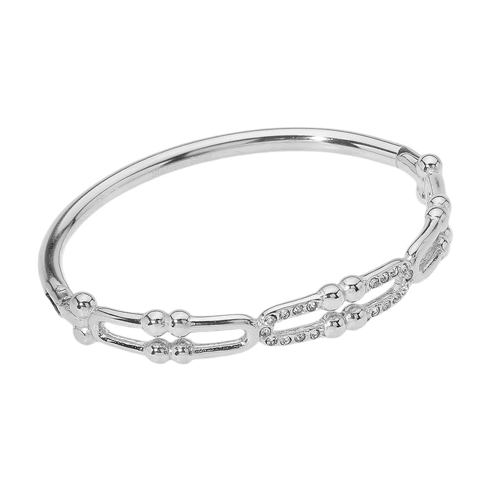 Silver Stainless Steel Stone Paved Abstract Hinged Bangle Bracelet boasts a timeless design and high-quality construction. Made with durable stainless steel and accented with sparkling stones, this bracelet elevates any look. Its hinged closure ensures a secure fit, making it perfect for everyday wear.