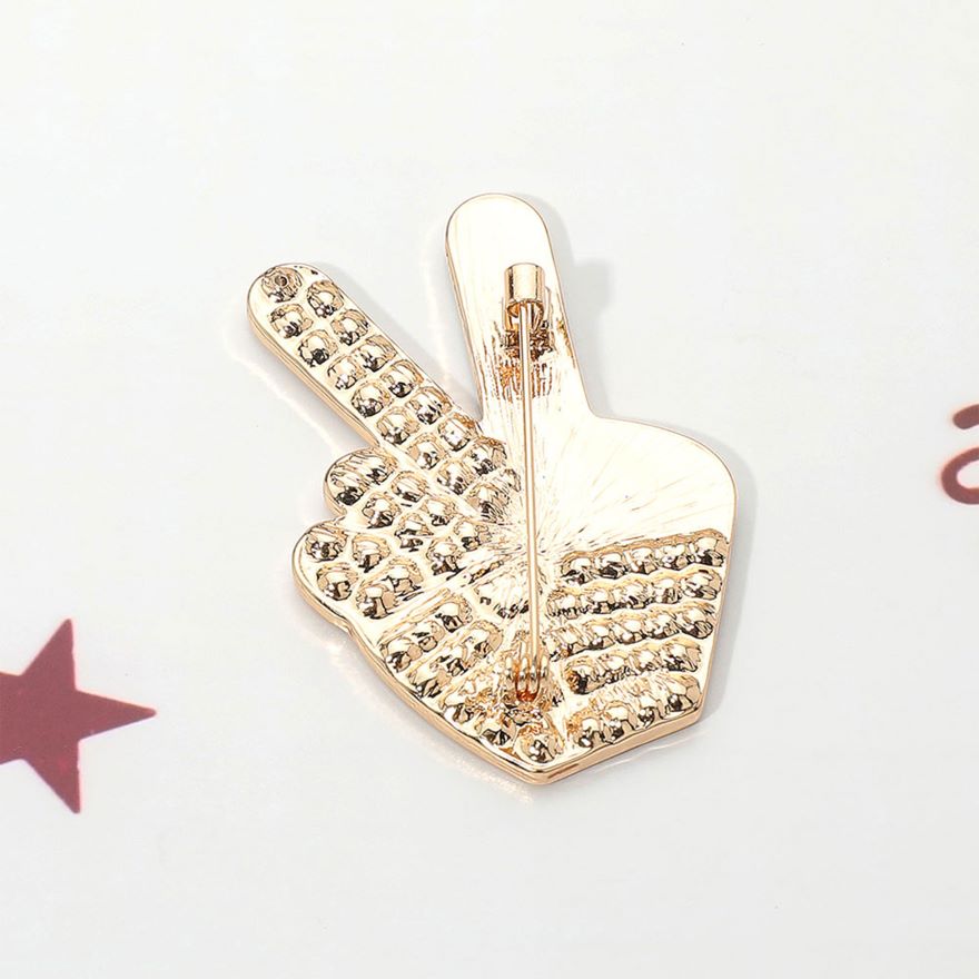 Gold Celebrate unity and patriotism with this Stone Paved American USA Flag Peace Hand Sign Pin Brooch, featuring a striking peace gesture filled with the iconic stars and stripes and accented by sparkling stones. A meaningful and stylish accessory, it’s perfect for adding a bold statement of freedom, harmony, and American pride to jackets, bags, or hats.