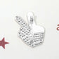 Rhodium Celebrate unity and patriotism with this Stone Paved American USA Flag Peace Hand Sign Pin Brooch, featuring a striking peace gesture filled with the iconic stars and stripes and accented by sparkling stones. A meaningful and stylish accessory, it’s perfect for adding a bold statement of freedom, harmony, and American pride to jackets, bags, or hats.