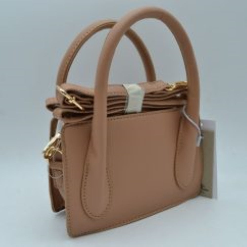 Stone This classic handbag features a structured rectangular silhouette with a smooth finish and clean stitched detailing, making it ideal for sophisticated everyday use. Designed with an open-top layout, it includes multiple divided storage compartments to keep your daily essentials organized and within reach. Dual arched top handles provide a comfortable grip for handheld carrying, while subtle metallic side rings offer a discreet attachment point for versatile styling options.