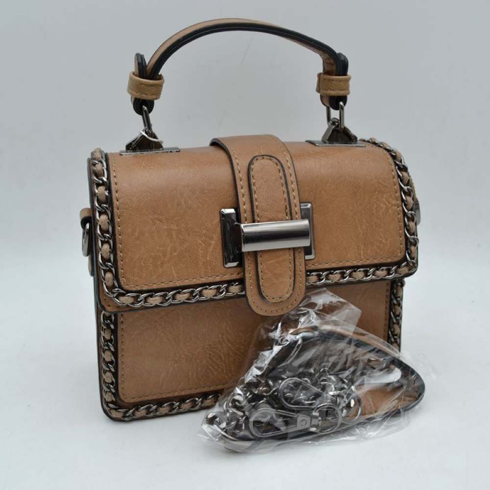 Stone Add a touch of structured elegance to your look with this chic top-handle satchel bag. Designed for the modern trendsetter, it seamlessly blends classic vintage vibes with contemporary edgy accents.