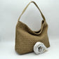 Stone This slouchy hobo bag showcases a textured woven pattern across its exterior, offering a refined look that is perfect for everyday use. The spacious main compartment provides ample storage for daily essentials, featuring a relaxed silhouette with a flat top shoulder strap for comfortable carrying. A separate, detachable secondary strap with metallic clasps is included, allowing for versatile styling options to suit your needs.
