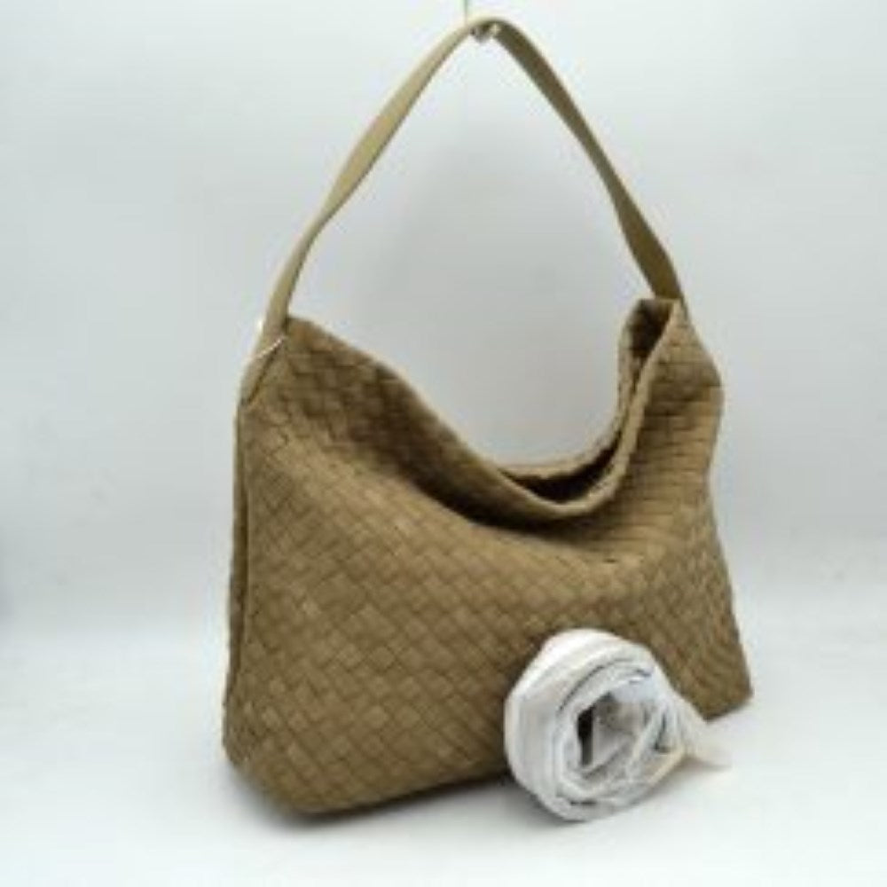 Stone This slouchy hobo bag showcases a textured woven pattern across its exterior, offering a refined look that is perfect for everyday use. The spacious main compartment provides ample storage for daily essentials, featuring a relaxed silhouette with a flat top shoulder strap for comfortable carrying. A separate, detachable secondary strap with metallic clasps is included, allowing for versatile styling options to suit your needs.