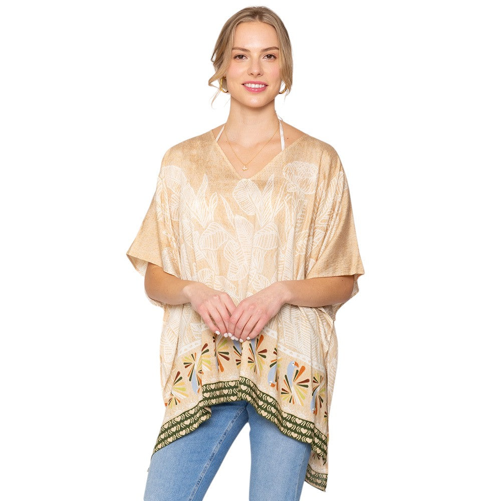 Tan Leaf Print Cover Up Poncho is the perfect addition to your summer wardrobe. Made from lightweight fabric, it is both stylish and functional, providing coverage from the sun while keeping you cool. The leaf print adds a touch of nature-inspired elegance to any beach or pool ensemble. 