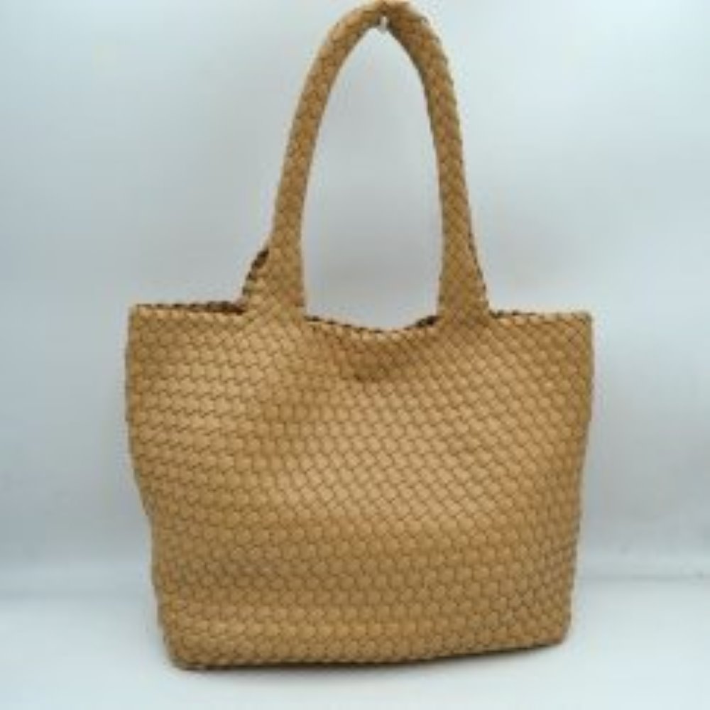 Tan This structured tote bag features an intricate basket-weave design across its body and integrated shoulder straps, creating a textured look suitable for everyday use. The main storage compartment offers a wide, open-top design for easy access to daily essentials. Accompanying the larger bag is a matching smaller pouch with a distinct woven exterior pattern and a secure gold-tone top zipper closure to keep smaller items organized.