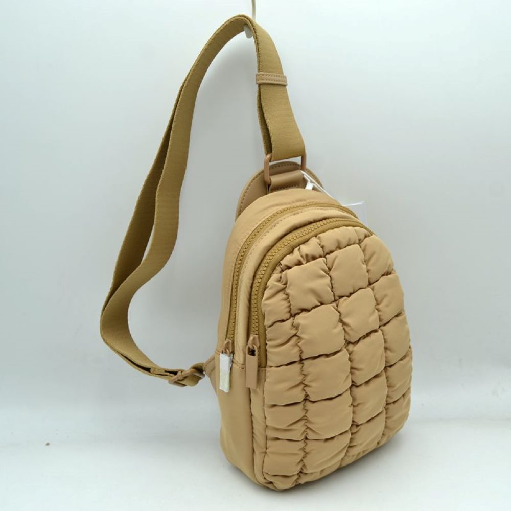 Tan Upgrade your active look with the Ergonomic Puffer Sling Bag. Combining a sleek, teardrop backpack silhouette with cloud-like padding, this ultra-lightweight bag is engineered for dynamic, on-the-move lifestyles—perfect for day trips, cycling, music festivals, or city commutes.