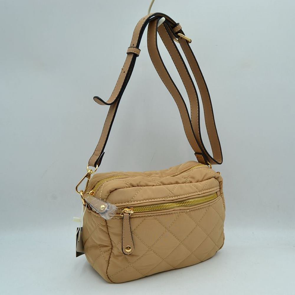 Tan Stay effortlessly organized on the move with this lightweight and stylish quilted crossbody bag. Combining a sporty nylon aesthetic with chic diamond quilting, this multi-pocket bag is the perfect accessory for travel, running errands, or everyday casual wear.