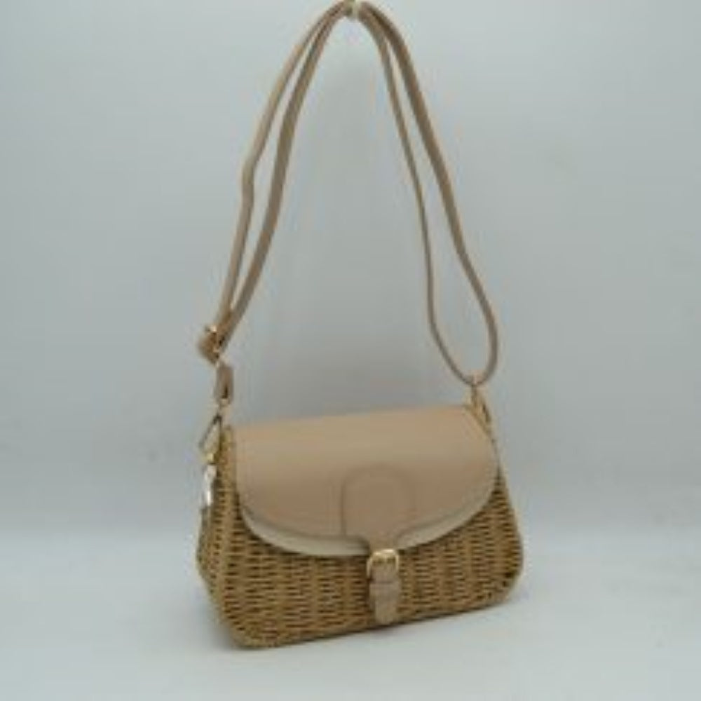 Tan This everyday shoulder bag features a distinct textured woven body paired with a smooth fold-over flap closure. The bag includes a main storage compartment secured by a front strap and buckle detail. It is equipped with a long, adjustable shoulder strap attached via metal hardware, providing versatile carrying options for daily use.