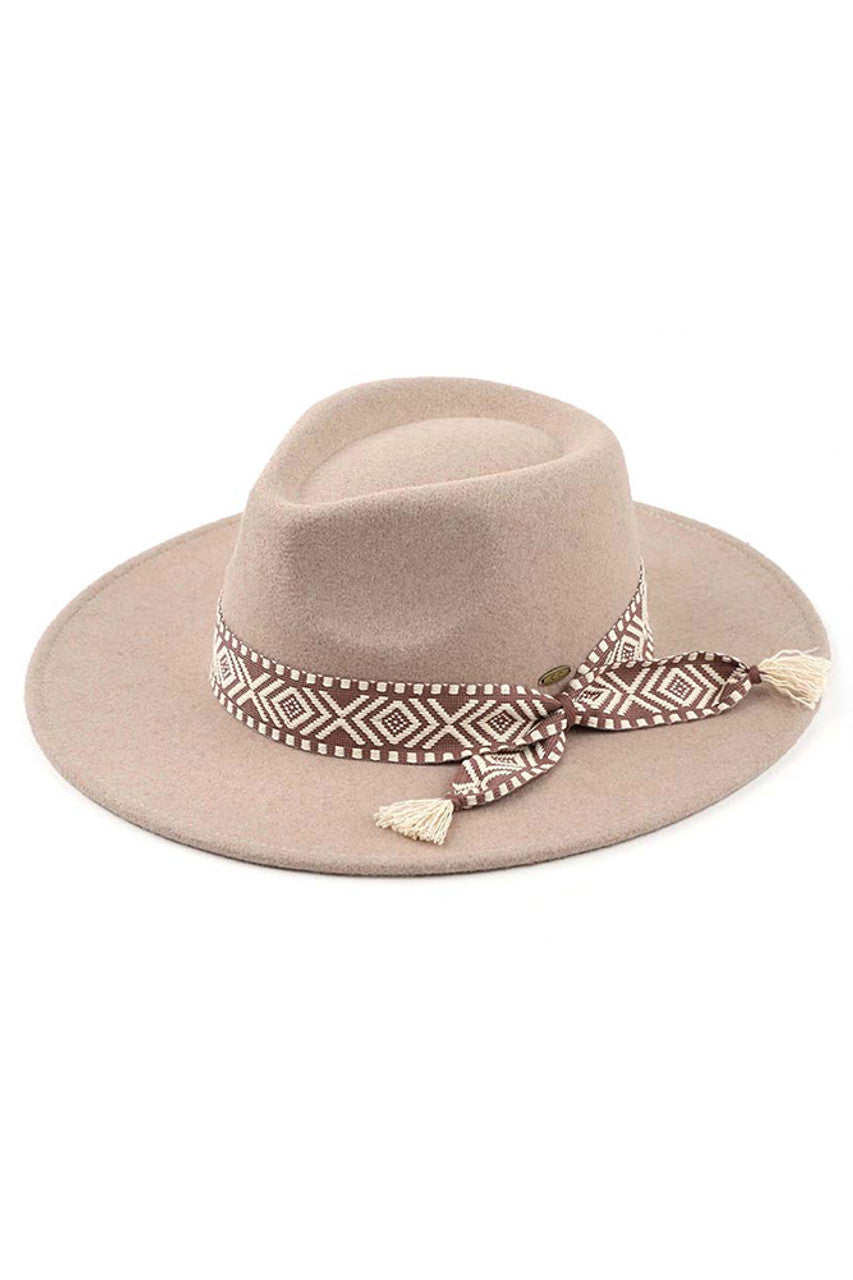 Taupe C.C Aztec Trim Vegan Felt Panama Hat is a must-have accessory for any fashion-forward individual. Made with 100% vegan felt, this hat is not only stylish but also eco-friendly. The Aztec trim adds a unique touch, making it a statement piece for any outfit. Stay on-trend and feel good about your fashion choices with this panama hat.