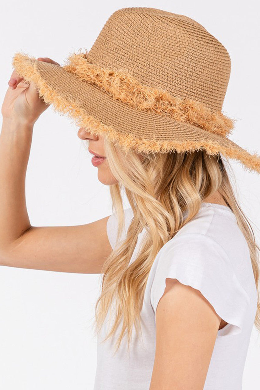 Taupe Frayed Band and Edge Trim Summer Straw Sun Hat features distinctive frayed band and edge trim detailing for a refined yet relaxed aesthetic. The breathable construction provides optimal sun protection while maintaining comfort during warm weather. Versatile design transitions seamlessly from beach outings to outdoor social events.