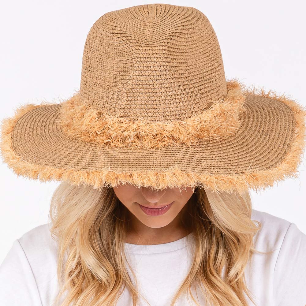Taupe Frayed Band and Trip Straw Sun Hat combines style and practicality. The frayed band adds a touch of texture, while the trip straw material provides superior sun protection. Perfect for a day at the beach or a stroll in the park, this hat will keep you both fashionable and protected.
