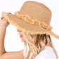 Taupe Frayed Band and Trip Straw Sun Hat combines style and practicality. The frayed band adds a touch of texture, while the trip straw material provides superior sun protection. Perfect for a day at the beach or a stroll in the park, this hat will keep you both fashionable and protected.