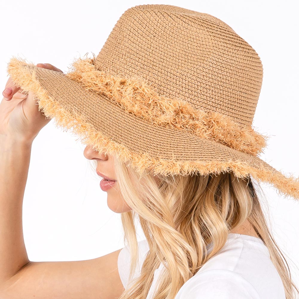 Taupe Frayed Band and Trip Straw Sun Hat combines style and practicality. The frayed band adds a touch of texture, while the trip straw material provides superior sun protection. Perfect for a day at the beach or a stroll in the park, this hat will keep you both fashionable and protected.