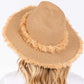 Taupe Frayed Band and Trip Straw Sun Hat combines style and practicality. The frayed band adds a touch of texture, while the trip straw material provides superior sun protection. Perfect for a day at the beach or a stroll in the park, this hat will keep you both fashionable and protected.