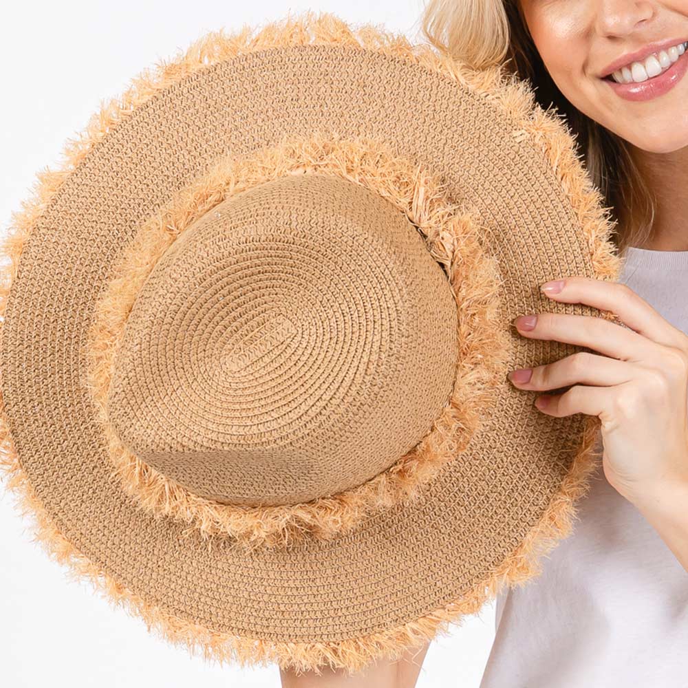 Taupe Frayed Band and Trip Straw Sun Hat combines style and practicality. The frayed band adds a touch of texture, while the trip straw material provides superior sun protection. Perfect for a day at the beach or a stroll in the park, this hat will keep you both fashionable and protected.