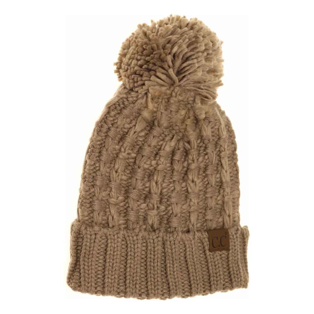 Taupe Slipstitch Pom Beanie expertly blends functional warmth with refined design. Crafted with a textured slipstitch knit, it ensures durability and a snug fit while maintaining breathability. The added pom offers a subtle yet distinctive accent, making this beanie an essential piece for both outdoor protection and polished winter style. 