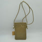 Taupe This compact vertical crossbody bag is designed for everyday functionality with a distinct woven textured pattern across its body. It features a slim, continuous cord strap attached securely to the sides with visible knot details for comfortable carrying. A clean horizontal opening at the top allows effortless access to the main storage compartment