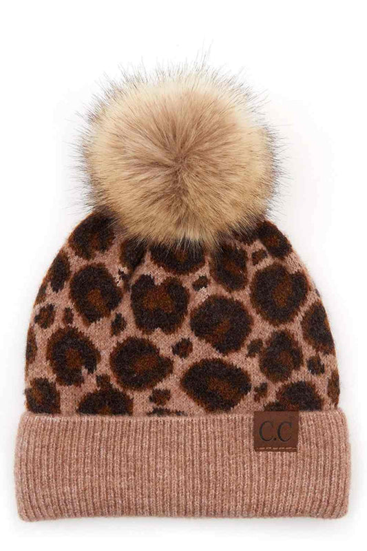 Taupe Stay cozy with this C.C Leopard Knit Beanie, featuring a playful pom-pom on top. Made from a thoughtful blend of 50% acrylic, 30% wool, and 20% nylon, this beanie combines warmth and durability for winter days.