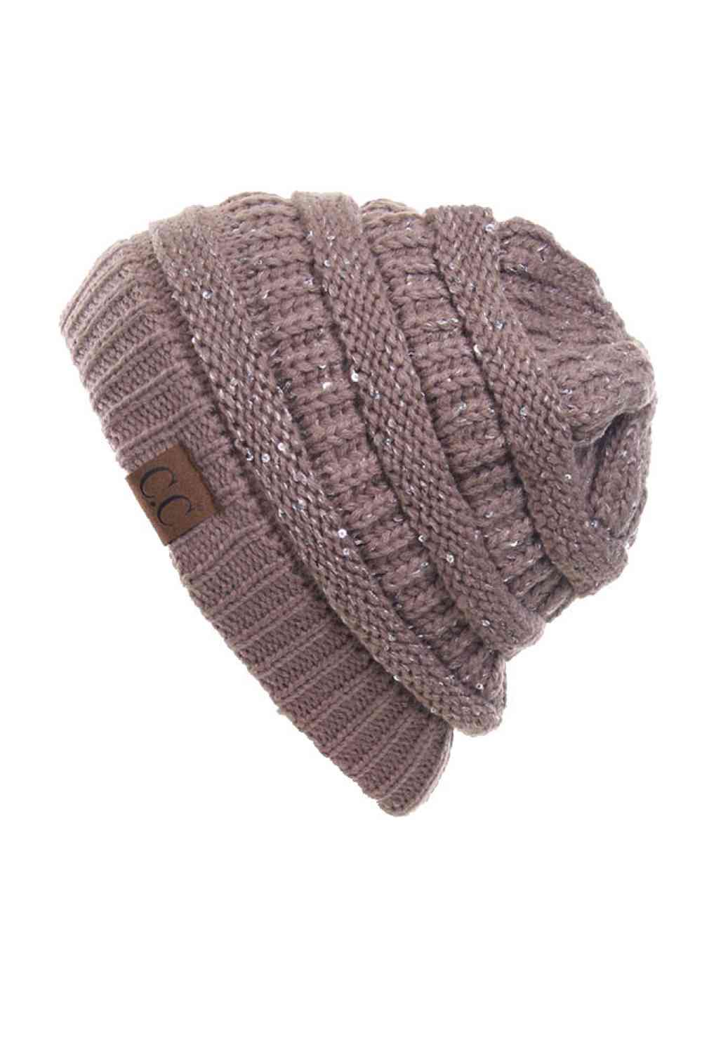 Taupe C.C Sequin Ponytail Messy Bun Beanie with open top design lets you pull your hair through for a stylish, effortless look. Crafted from 100% soft acrylic, this cozy beanie keeps you warm while showcasing your ponytail or messy bun. The shimmering sequin detailing adds sparkle and dimension to your winter style. Perfect for casual days, outdoor activities, or layering under jackets. One size fits most for comfortable, versatile wear that works with any outfit.