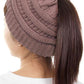 Taupe The C.C Solid Color Ponytail Messy Bun Beanie combines comfort with versatility for effortless everyday style. Crafted from 100% soft acrylic, this beanie features an open crown design that accommodates ponytails and messy buns while keeping you warm. The one-size-fits-most construction ensures a secure, flattering fit for virtually anyone. Perfect for casual outings, workouts, or relaxed weekends, this practical accessory transitions seamlessly from season to season.