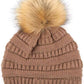Taupe Stay warm and cozy with this classic C.C Pom Pom Knit Beanie, crafted from 100% soft acrylic for all-day comfort. The ribbed knit design adds texture and durability, while the signature pom pom on top brings a playful touch to any winter outfit. One size fits most, making it the perfect accessory for everyone. Ideal for cold weather adventures or casual everyday wear.