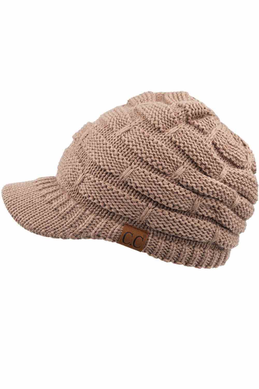 Taupe The C.C Ribbed Knit Brim Beanie combines comfort and style in one versatile piece. Made from 100% acrylic, this lightweight beanie features a classic ribbed knit construction with a structured brim for added warmth and coverage. Perfect for casual outings or outdoor activities, it pairs effortlessly with any winter wardrobe.