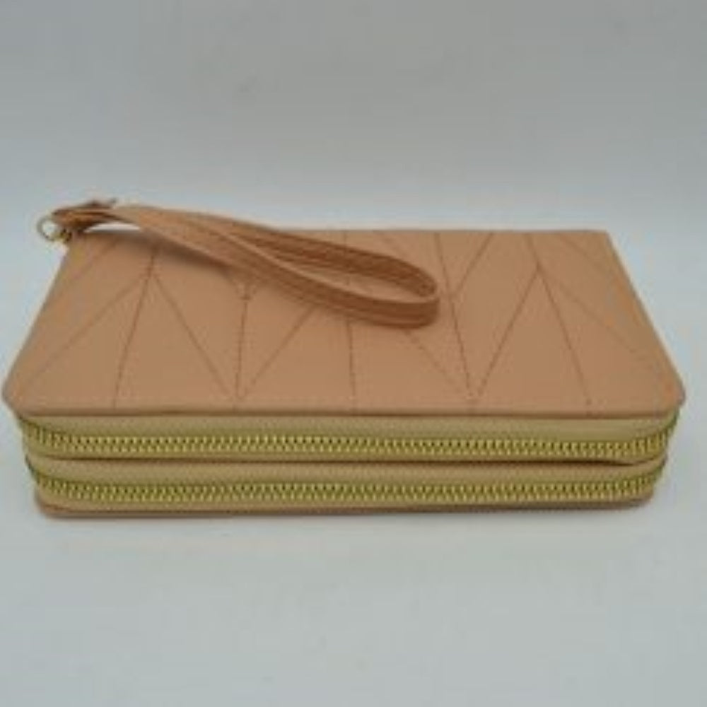 Taupe This rectangular long wallet features a distinctive geometric stitched pattern across its exterior, providing a refined and structured look for everyday use. Designed to offer organized storage compartments, it incorporates a dual zip-around closure system with prominent metallic zippers to keep essentials secure. A matching, detachable flat wristlet strap is connected to the side hardware with a metallic clasp, providing an easy and convenient hands-free carrying style.