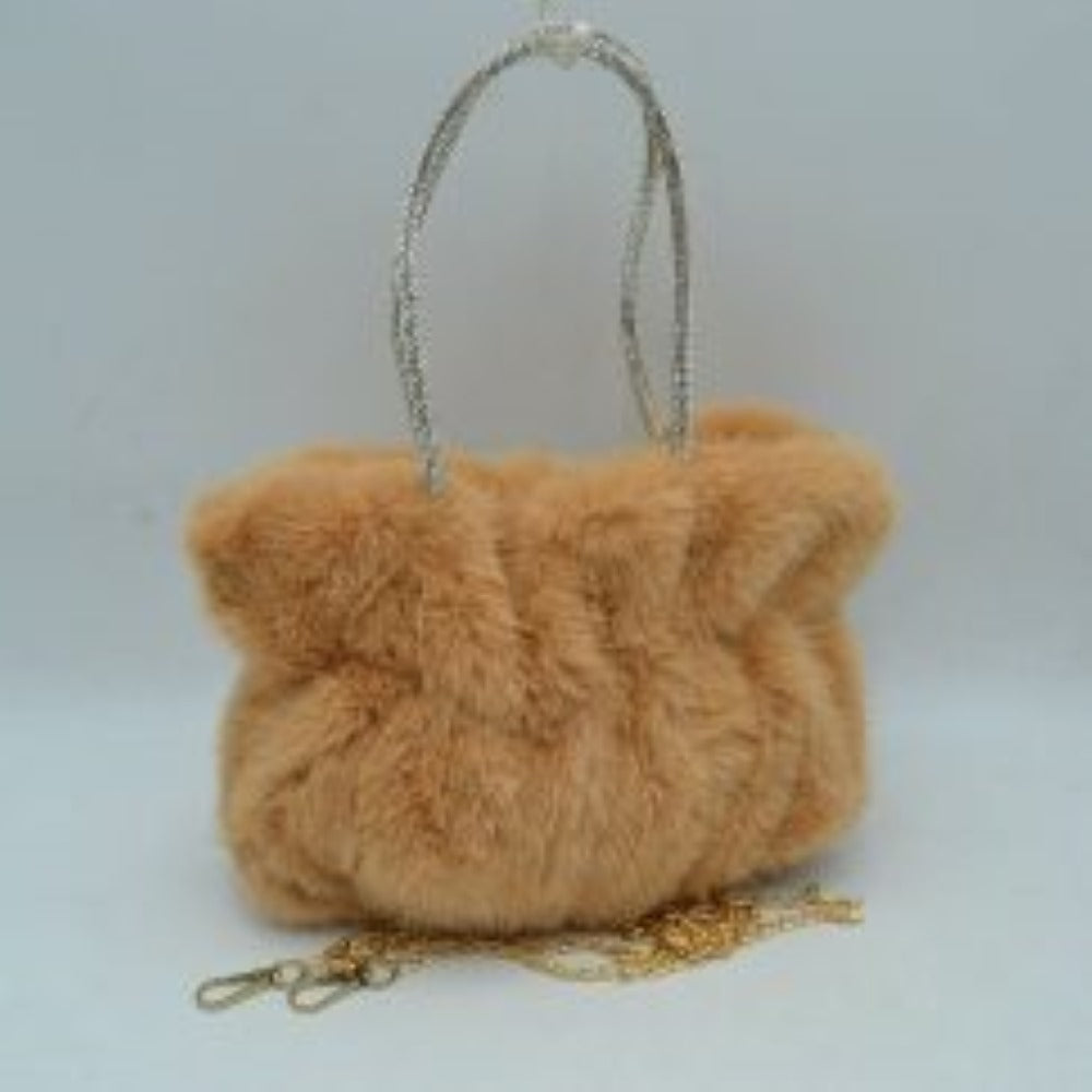 Taupe This unique everyday handbag features a soft, dense plush exterior that brings a cozy texture and modern look to your accessory collection. Designed with a slouchy, gathered silhouette, it features a central main storage compartment to keep your daily items within easy reach. The bag stands out with dual top handles covered in shimmering rhinestone details for elegant hand carrying, alongside a detachable metallic chain strap that offers versatile hands-free shoulder wear.